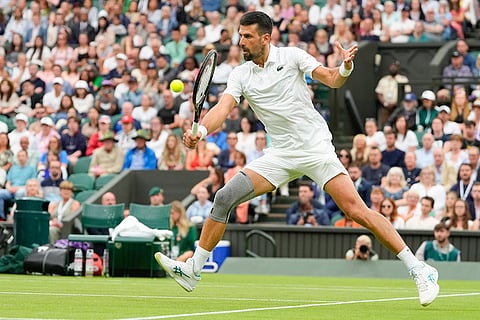 Djokovic plays a backhand return to Vit Kopriva